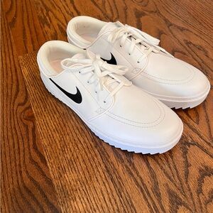 Nike White Athletic Shoes with Black Swoosh